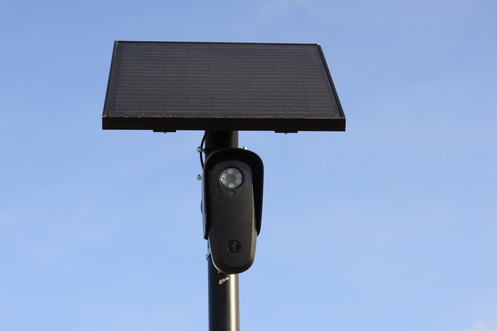 A close-up of a Flock Safety camera on a pole 